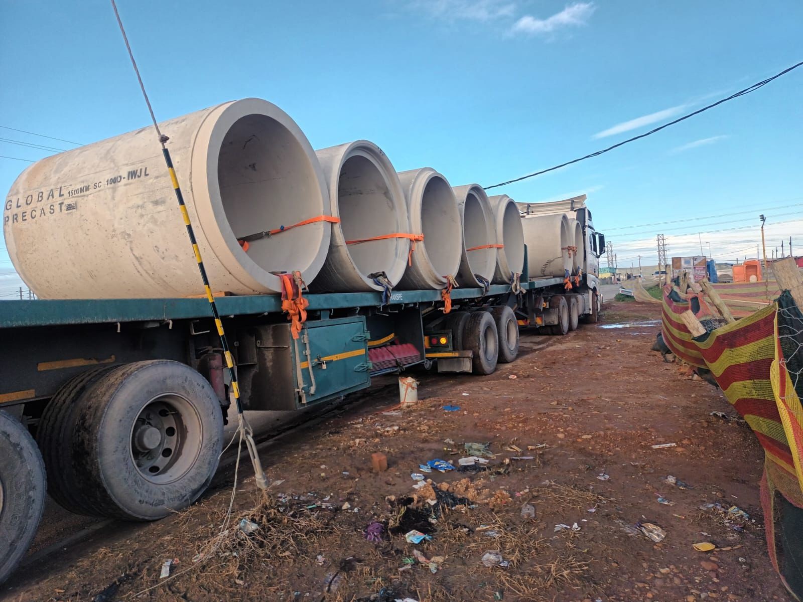 Large concrete culvert pipes loaded on a truck for delivery