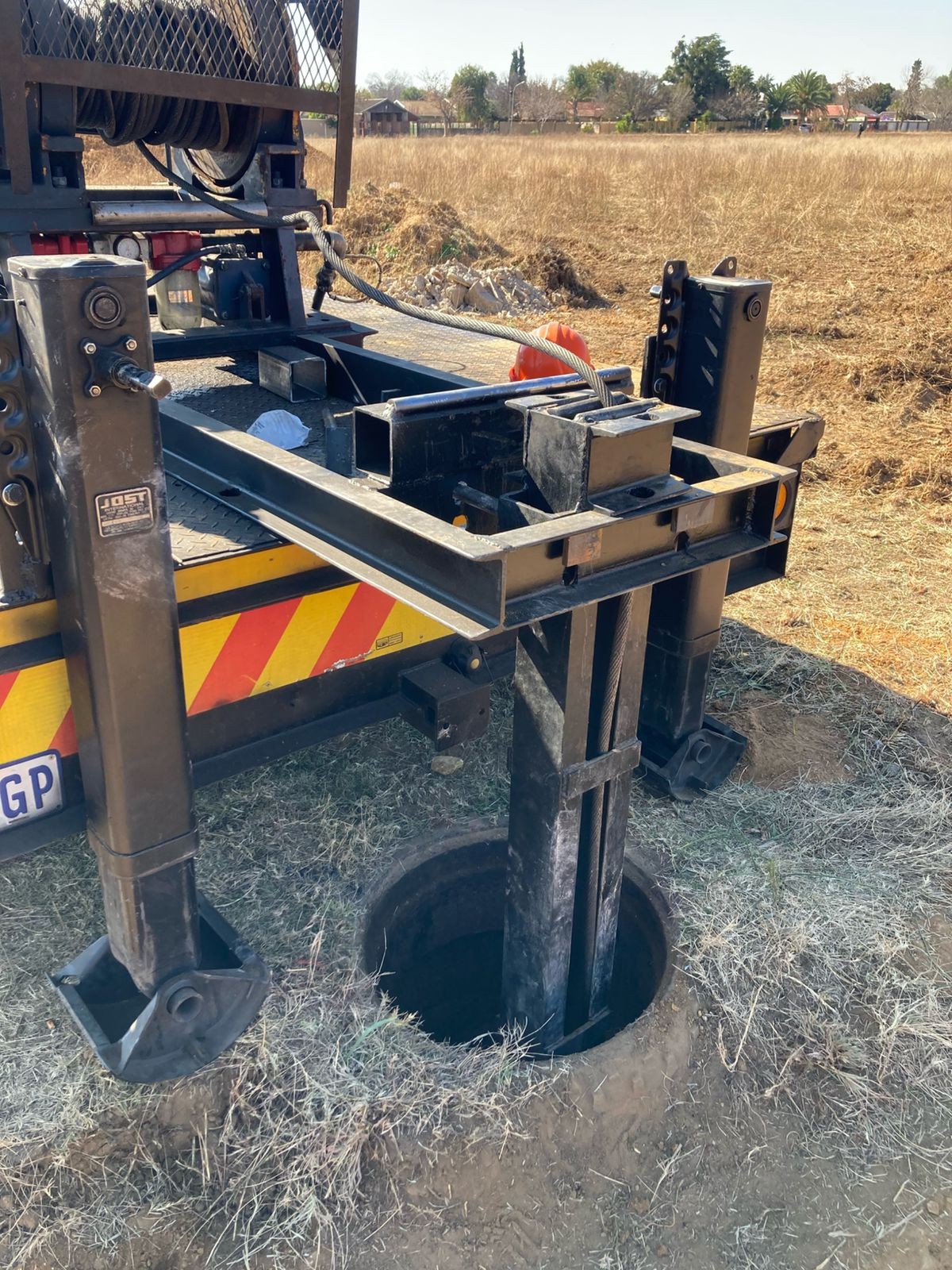 Drilling rig set up in an open rural field
