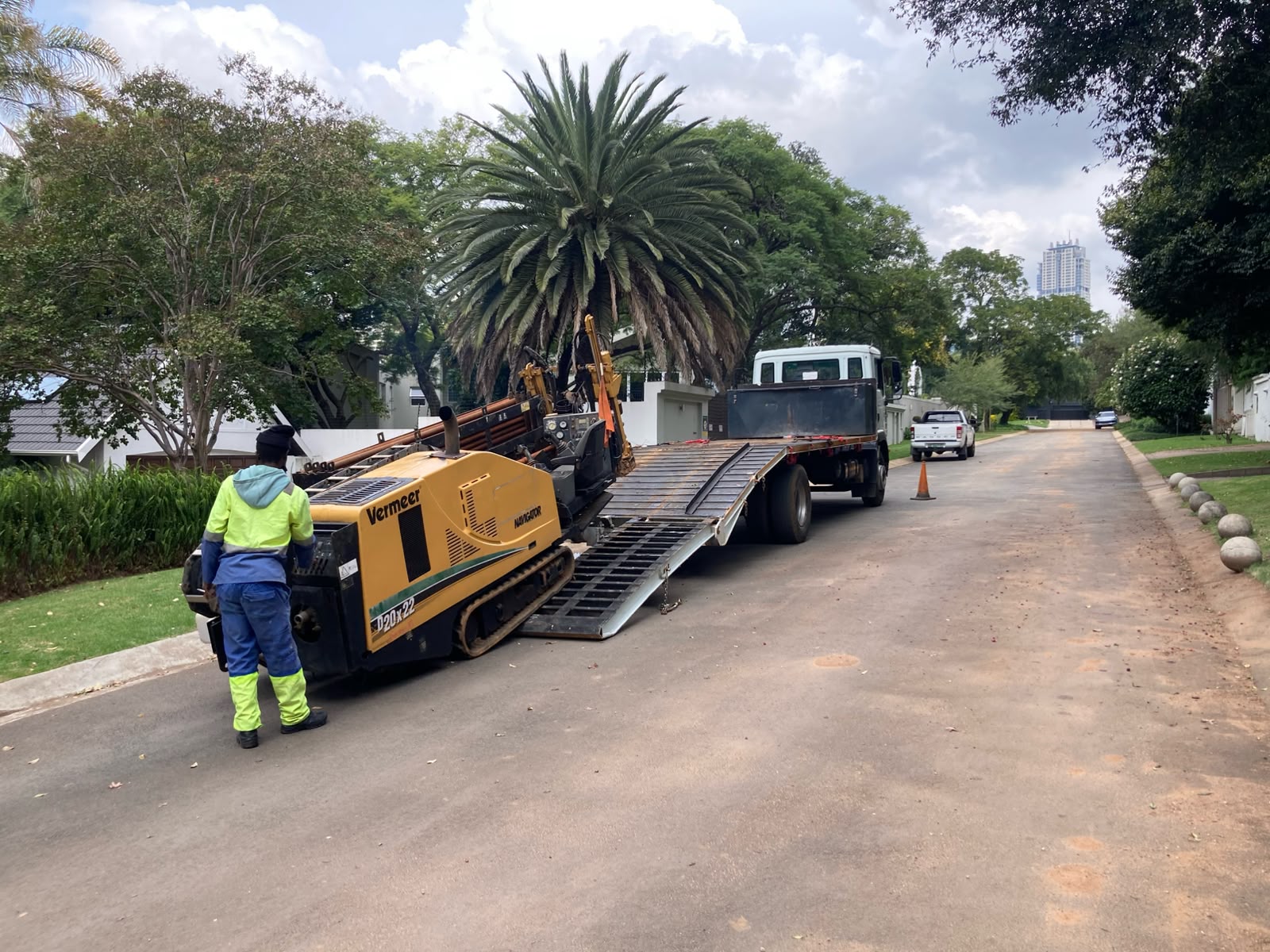 Intac Global directional drilling rig being offloaded from a flatbed truck on site